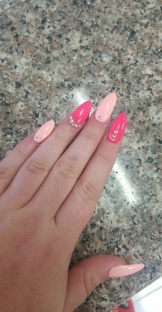 Nail polish bottles lined on salon shelves.