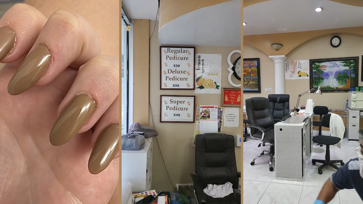 Close-up of acrylic nails beside manicure supplies.